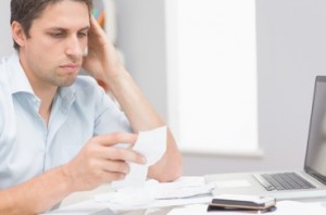 Stay on top of bills and budget your money well to help reduce the stress in your life. (Photo: Wavebreak Media on Shutterstock)